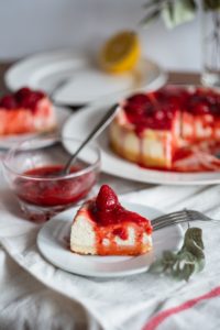 slice of cake on saucer plate with fork